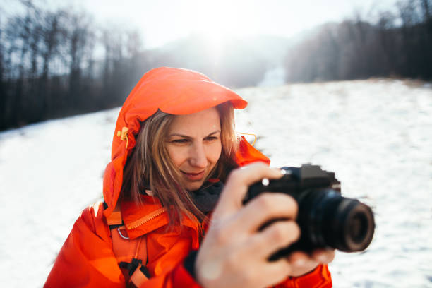 Young hiker enjoy her adventure and making photos to remember amazing moments