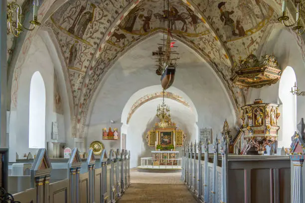 Interior of a lutheran church in Demark with paintings from the 1400s, Tingsted, Denmark - April 11, 2017