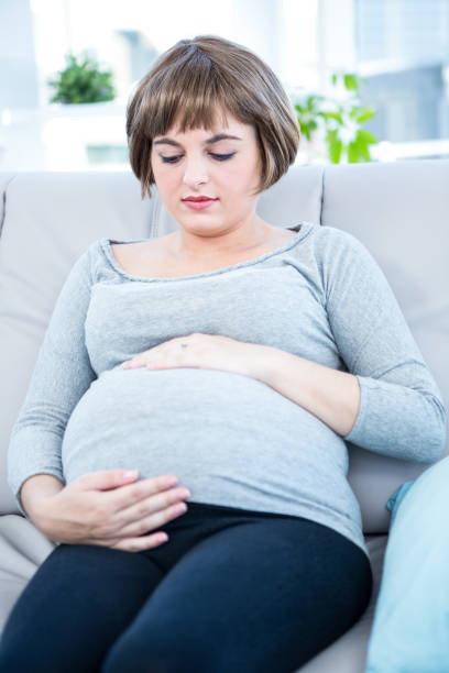 istock Pregnant woman touching her belly 671686846