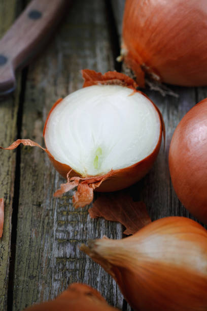 istock Close-up of chopped onions on an old rustic table. Macro shot. 671693256