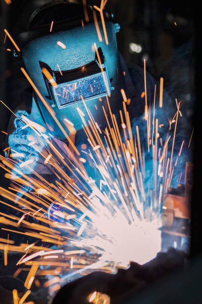 istock Worker is welding in factory 671693326