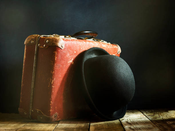 istock Old vintage suitcase on a wooden floor. 671699434