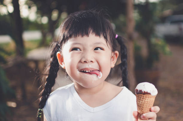 Asia Girl eating ice cream.
