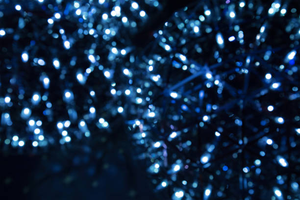 istock abstract blue bokeh light on the dark background. 671701934