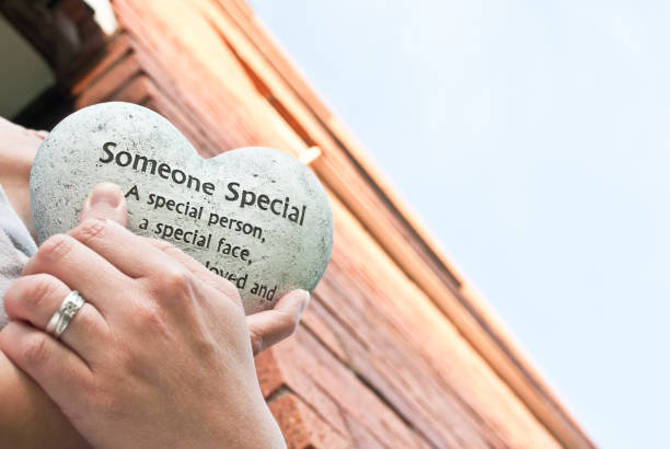 istock In memory of: Hand holding a 
