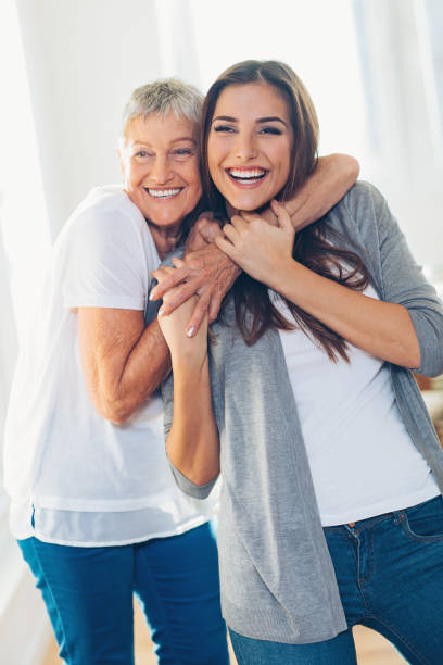 istock Happy mother and daughter embracing 671705420