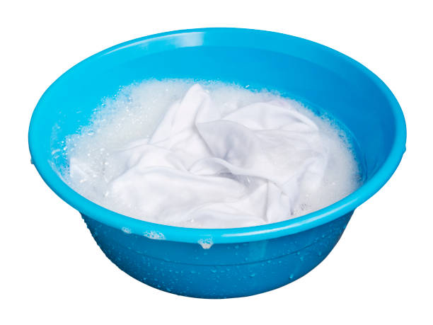 istock Soak whites clothes in the enameled bowl on white background with clipping path 671705886