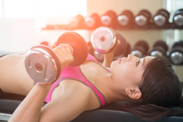 istock sport woman with dumbbell 671706738