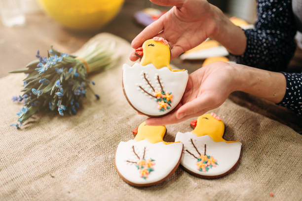 Female hands holds sweet cookies with pictures