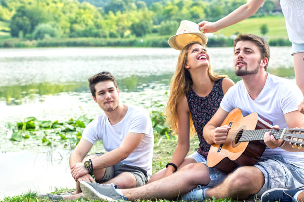 istock Happy Young people having party outdoor 671713762