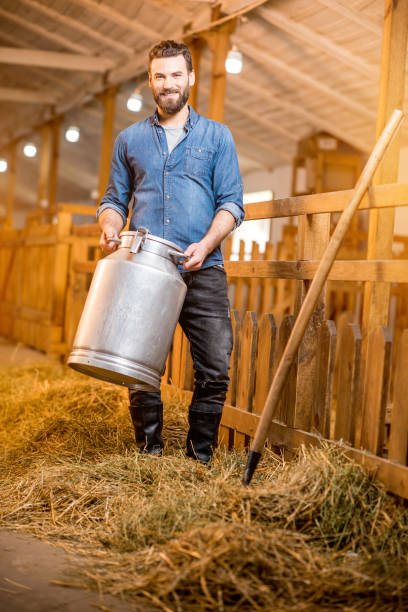 istock Farmer in the goat barn 671716968