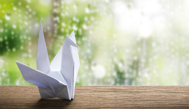 istock Origami paper crane in rainy day 671717012