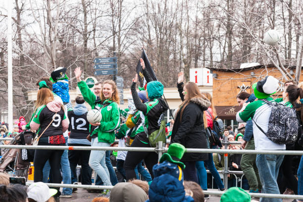 St Patrics Day Parade in Moscow MOSCOW, RUSSIA - MARCH 18, 2017. 25th St. Patric Day parade takes place in Sokolniki park of Moscow as part of the Irish Week 2017 festival. Moscow clubs of Irish sports walk along the catwalk. irish punt note stock pictures, royalty-free photos & images