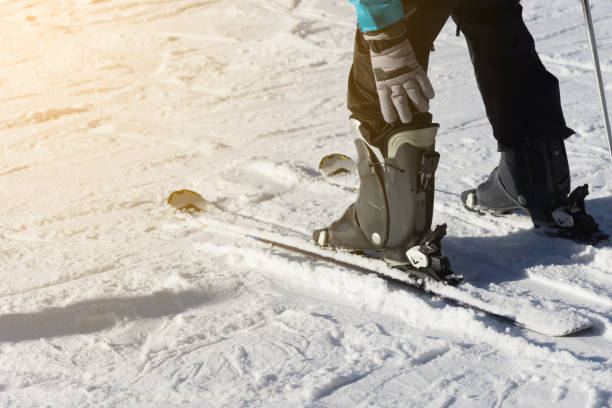 istock close up of ski low angle with sun light 671724448