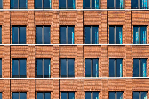 istock facade of modern bulding with windows 671727752