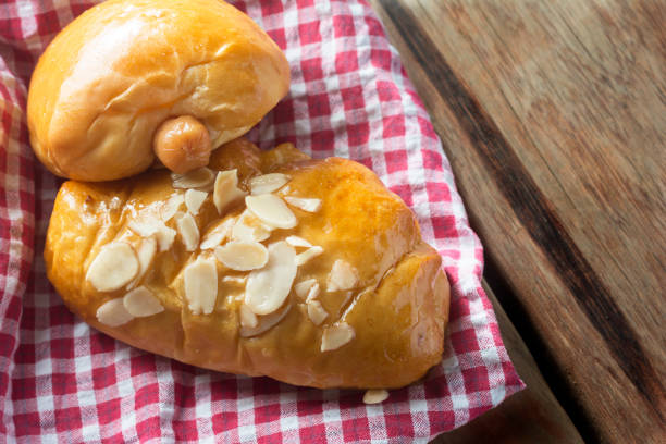 istock Sausage roll and Bread on wooden table. 671731518