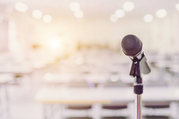 istock Microphone in Conference Seminar room Event Background 671733994