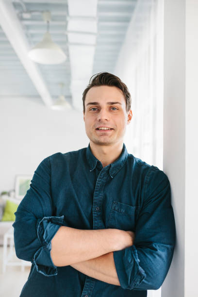 istock A handsome brutal strong man stands and smiles. 671747812