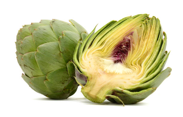 istock Fresh Artichokes isolated on white background 671750474