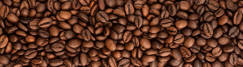 Close up of a heap of roasted coffee beans.