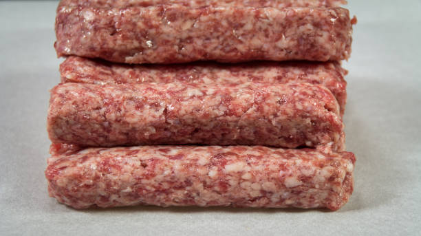 istock Raw kebab minced meat on white paper for grilling 671764406