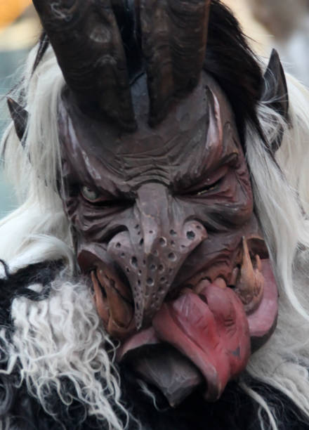 istock Monster mask during Santa Klaus parad 671764830
