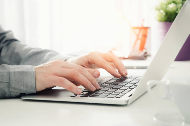 istock Man working in the office with laptop 671764940