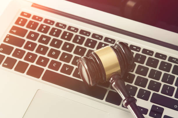 istock Wooden gavel on laptop keyboard 671765028