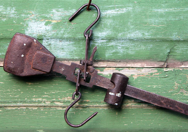 Vintage steelyard on a wooden background