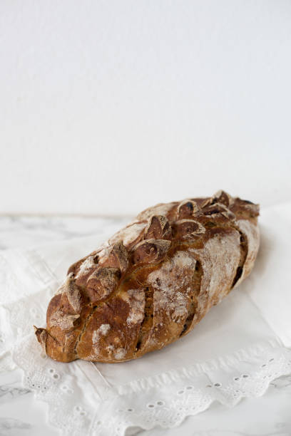 istock Fresh home made bread with nuts and dry fruits on marble background 671773556