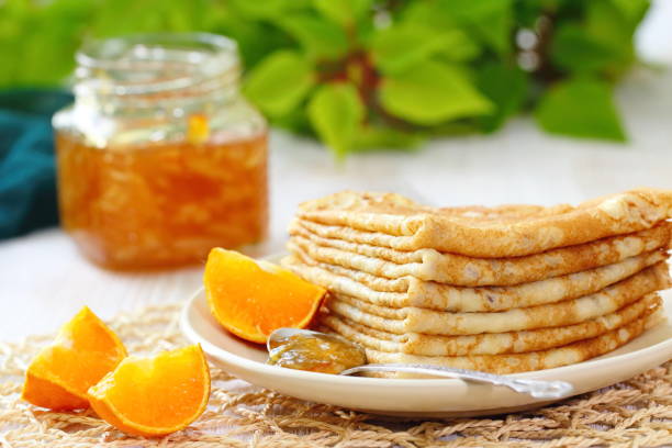 istock Pancakes with orange jam and fruit 671776048