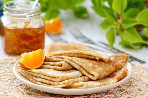 istock Pancakes with orange jam and fruit 671776054