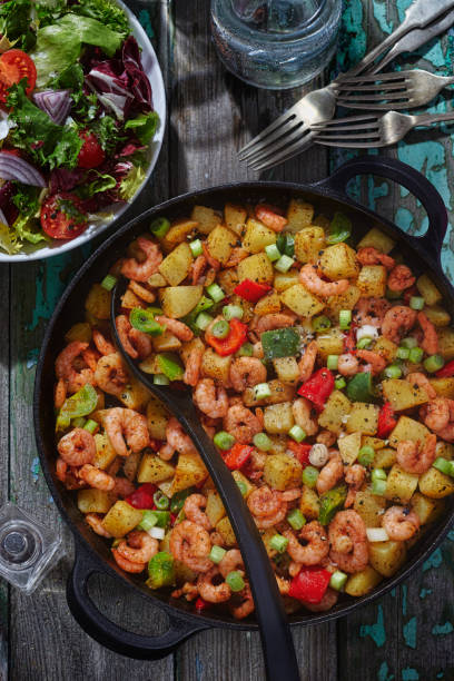 istock Prawns with potatoes and scallions 671779496