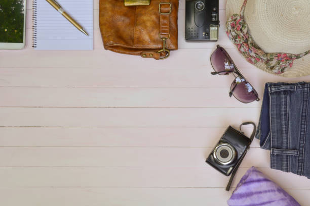 istock Camera and supplies wooden table background with copy space. 671789560