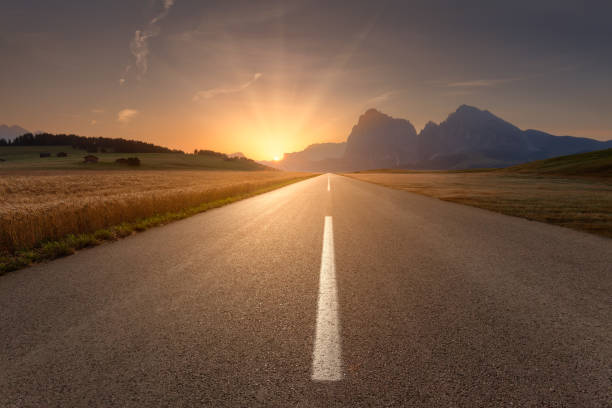 istock Beautiful scenery with road towards the setting sun 671793246