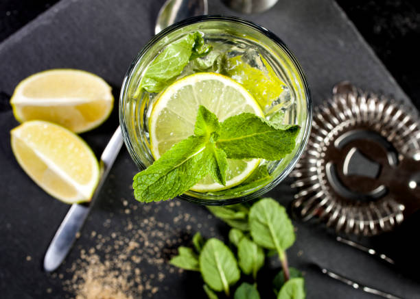 istock Mojito cocktail making. Ingredients and utensils. 671800230