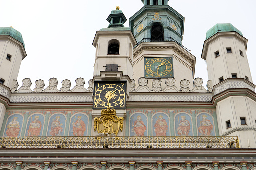 Top of the main entrance of the Leipzig City hall with the St. Trinity Catholic Church looking to it