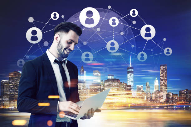 istock Bearded man with laptop in blue city 671803134