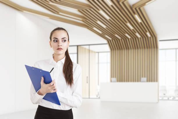istock Woman with clipboard and reception with pipes 671806940