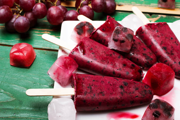 istock Homemade blueberry and grape ice cream on a stick 671810572