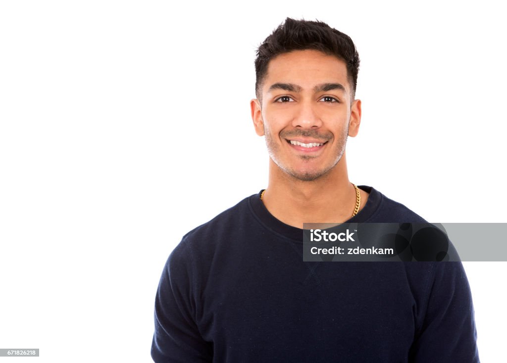 casual east asian man on white isolated background young indian man wearing dark blue sweater Men Stock Photo