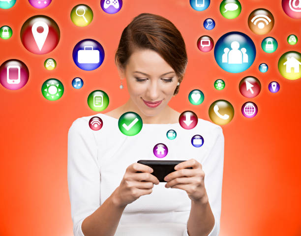 istock communication technology mobile phone high tech concept. Businesswoman using texting smartphone with social media application symbols icon flying out of cellphone 671829154