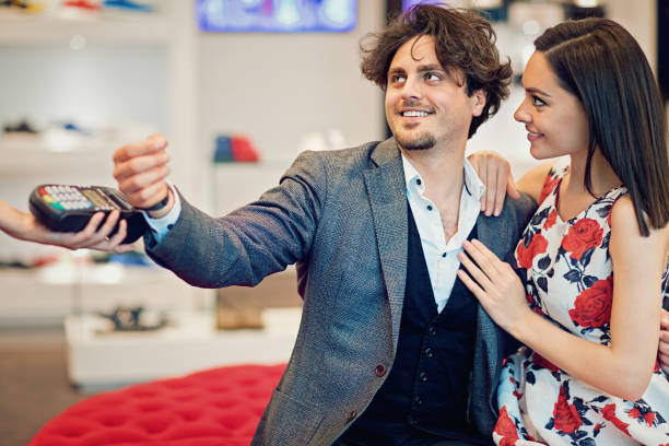 istock Couple is paying using smart watch in the Mall 671829950
