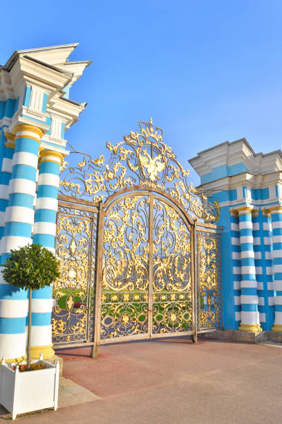 Gate of Catherine palace fence in Tsarskoye Selo. Gate of Catherine palace fence in Tsarskoye Selo with golden double-headed eagle, suburb of St.Petersburg, Russia. catherines gate stock pictures, royalty-free photos & images