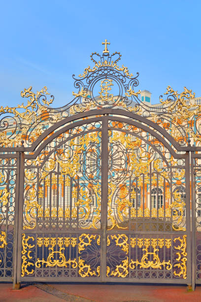 Gate of Catherine palace fence in Tsarskoye Selo. Gate of Catherine palace fence in Tsarskoye Selo with golden double-headed eagle, suburb of St.Petersburg, Russia. catherines gate stock pictures, royalty-free photos & images