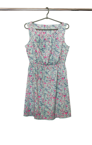 istock Summer dress with a butterfly pattern hanging on a hanger, isolated 671842198