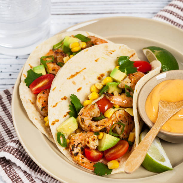 istock Shrimp Tacos with Corn and Avocado Salsa 671845378
