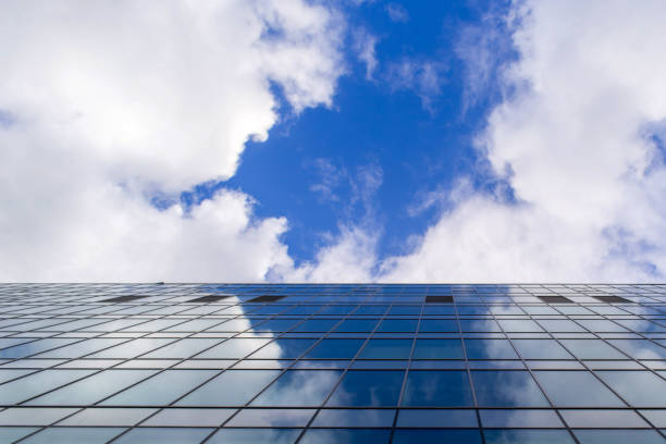 istock Sky reflection on glasses of the building 671845380