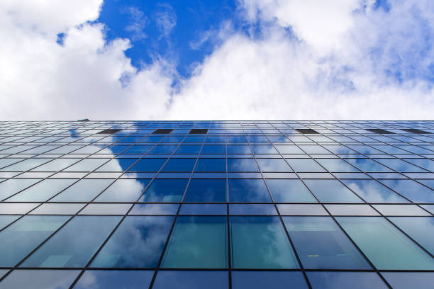 istock Sky reflection on glasses of the building 671847750