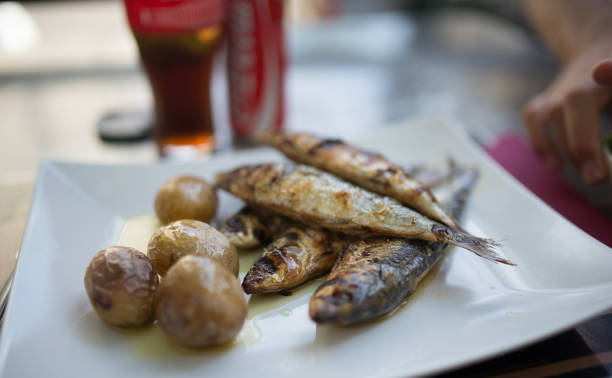 istock Grilled Sardines Plate with Red Pepper and Potato 671858434